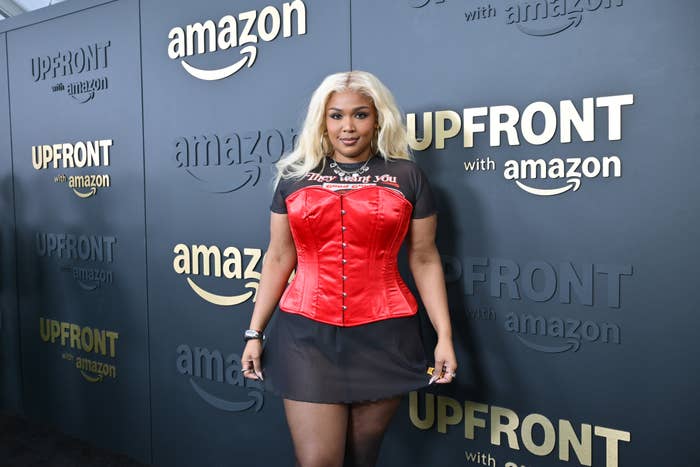 Lizzo performing live, showcasing her resilience and artistry