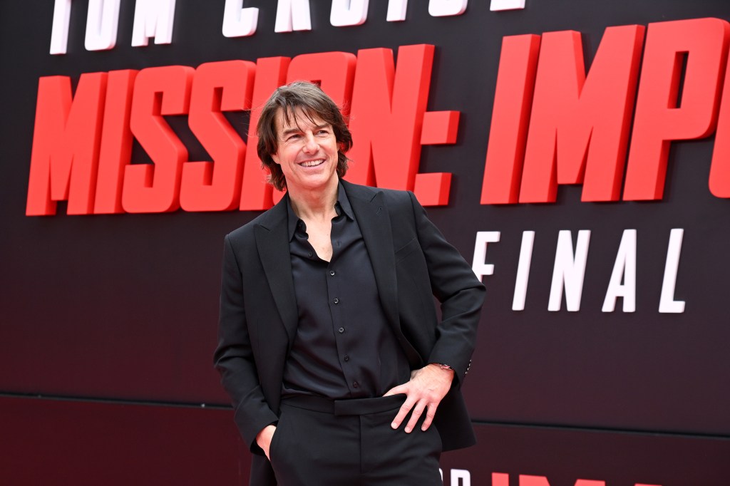 Tom Cruise performing action stunt