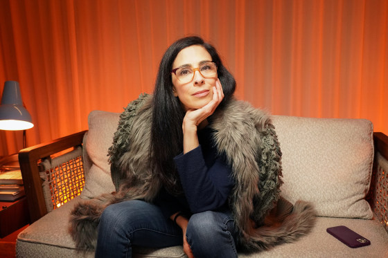 Sarah Silverman on stage with a heartfelt expression