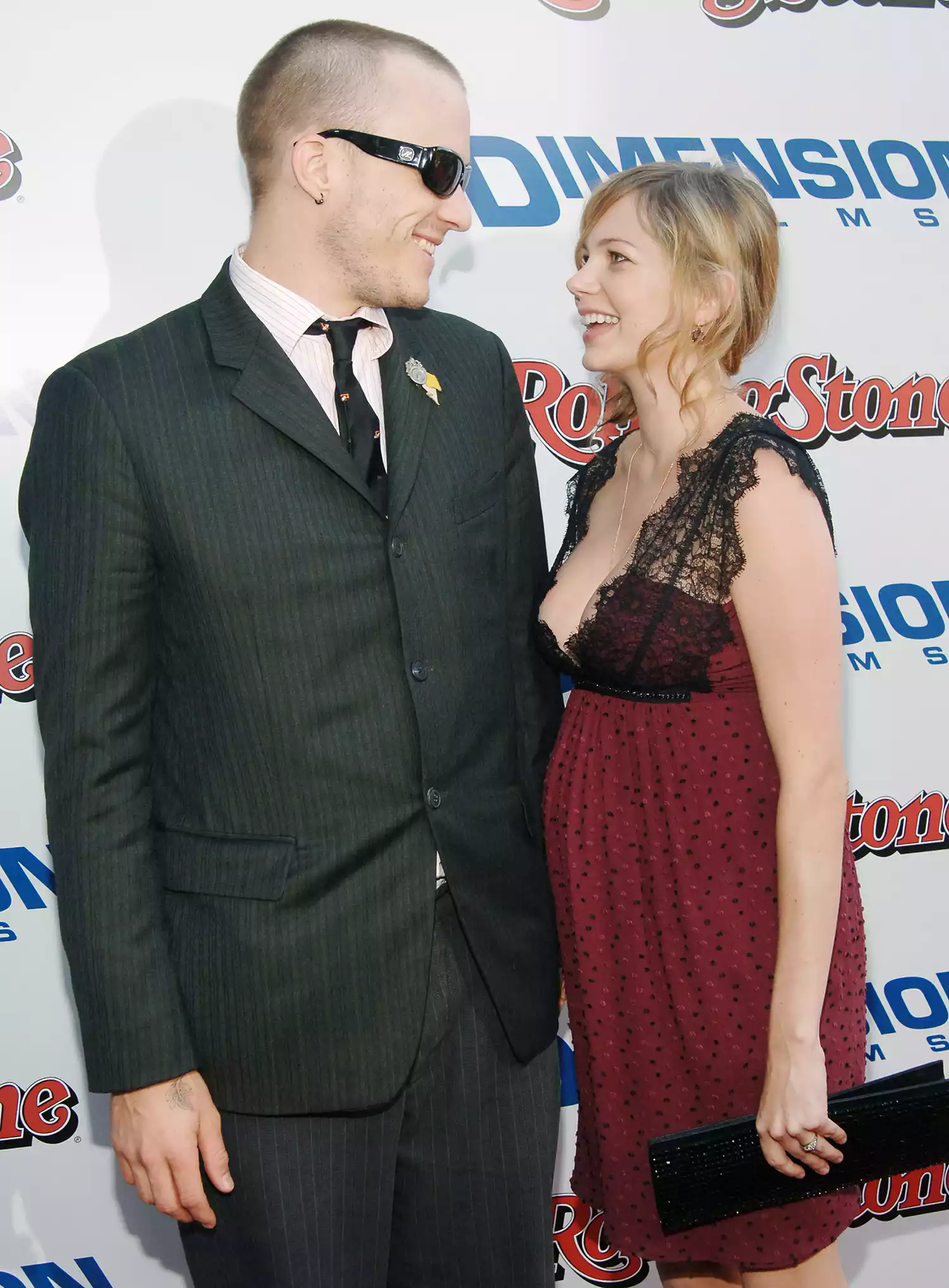 Heath Ledger smiling at an event, symbolizing his legacy