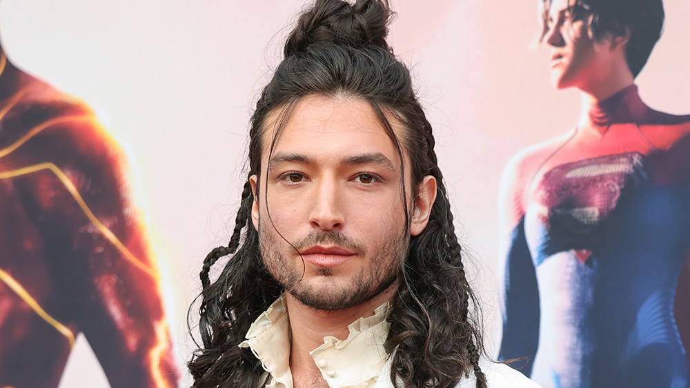 Ezra Miller walking the Cannes red carpet in 2025, marking their return after controversies